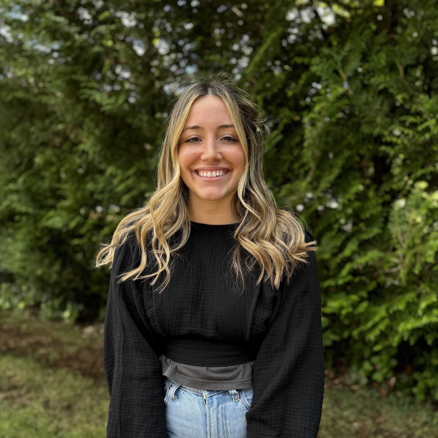 Portrait of Stevi Podowicz, a professional stylist at Robert Allan Salon, showcasing their expertise and style.