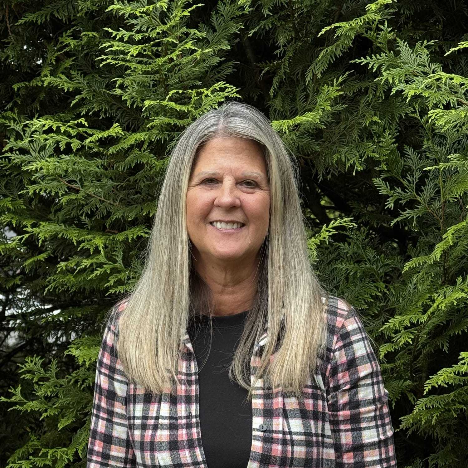 Portrait of Candi Adams, a professional stylist at Robert Allan Salon, showcasing their expertise and style.