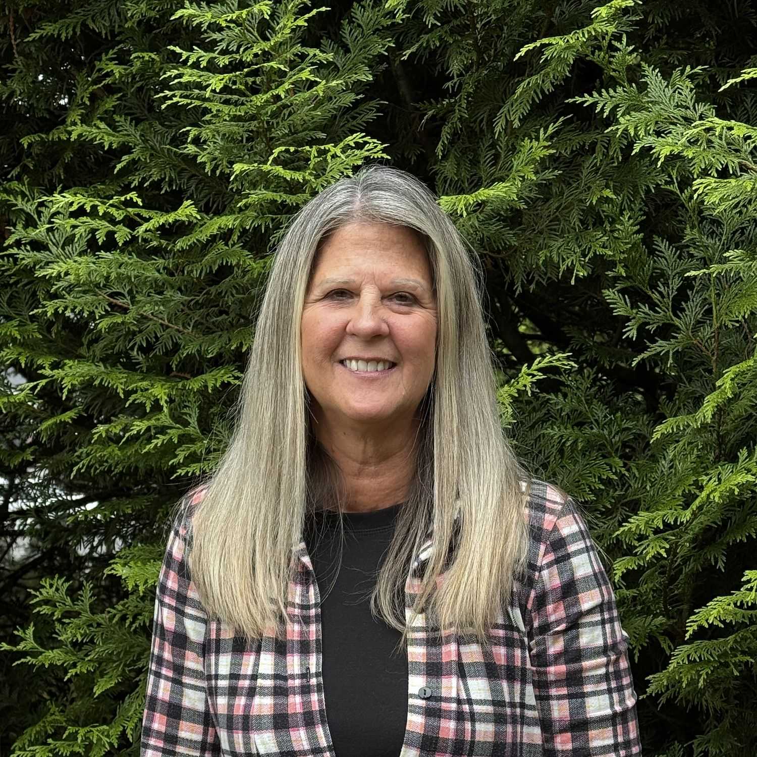 Portrait of Candi Adams, a professional stylist at Robert Allan Salon, showcasing their expertise and style.