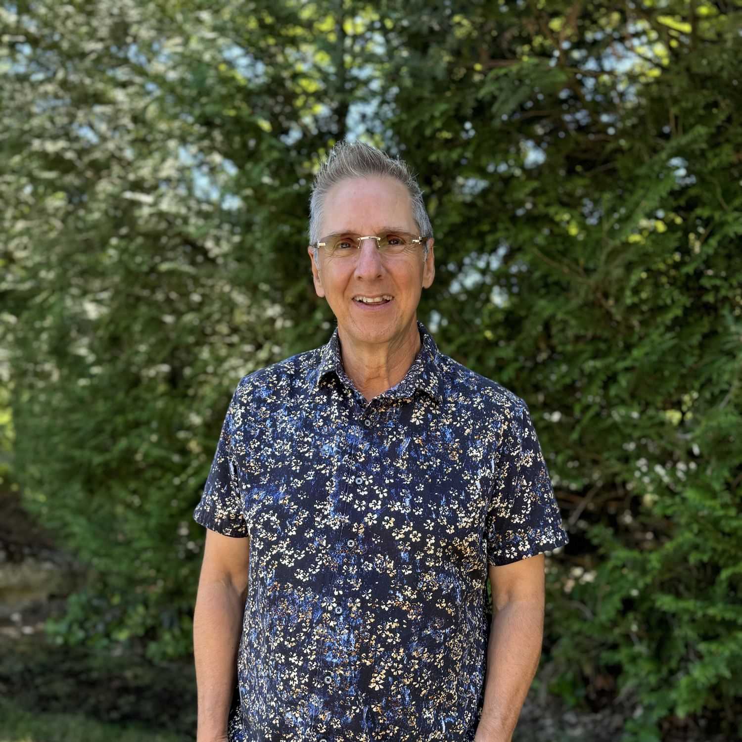 Portrait of Allan Munguia, a professional stylist at Robert Allan Salon, showcasing their expertise and style.