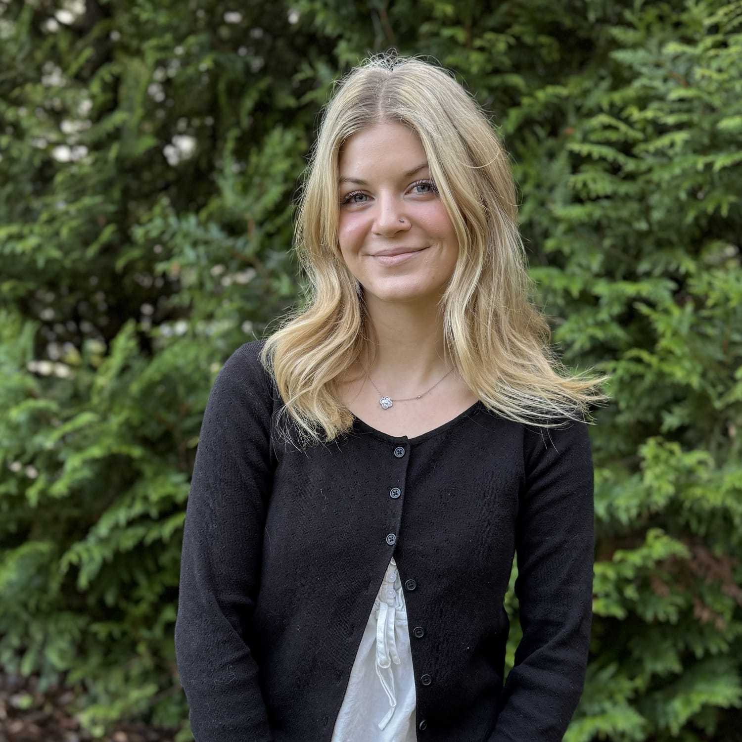 Portrait of Kylee Gruhn, a professional stylist at Robert Allan Salon, showcasing their expertise and style.