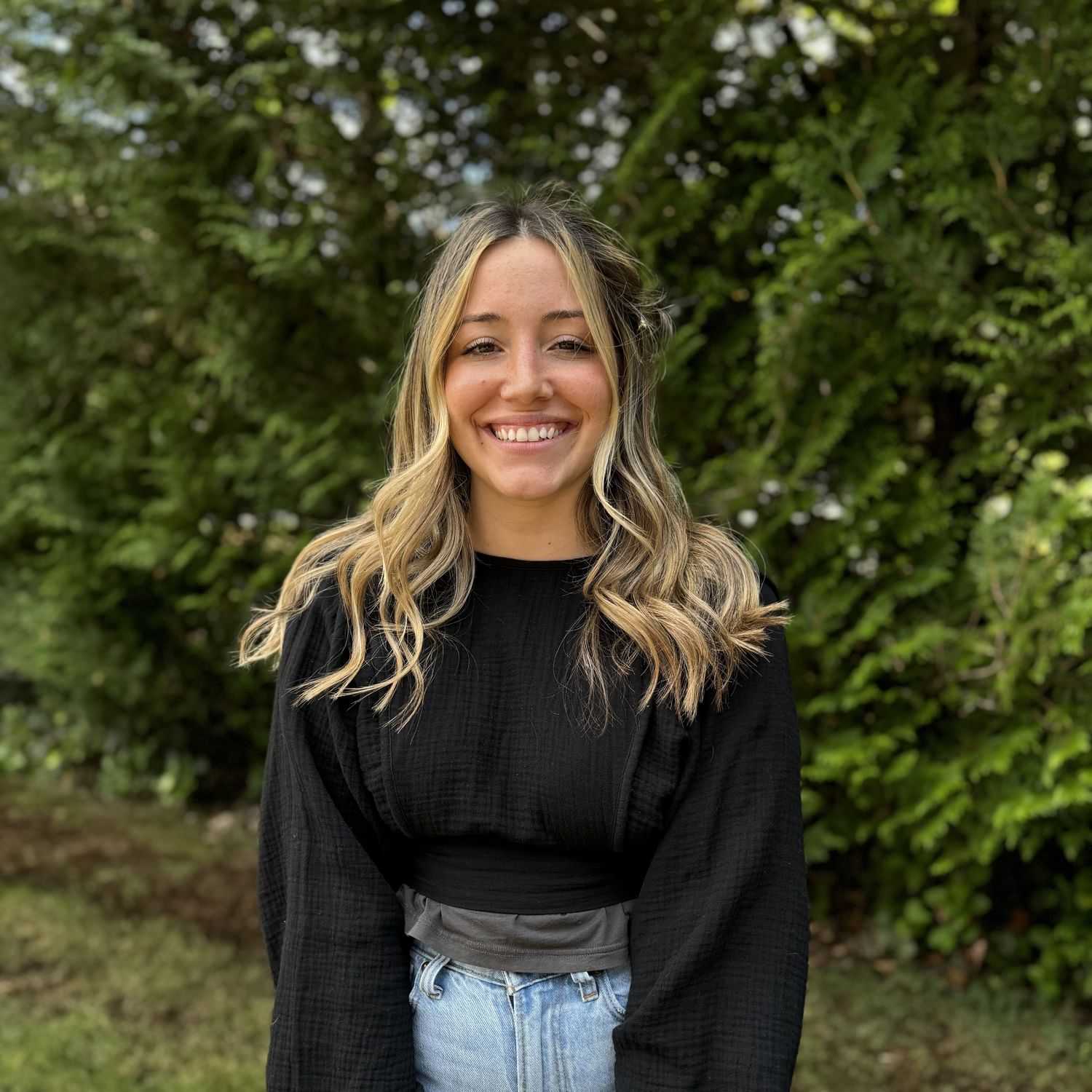 Portrait of Stevi Podowicz, a professional stylist at Robert Allan Salon, showcasing their expertise and style.